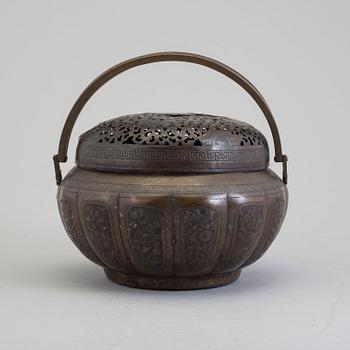 A Chinese engraved bronze hand warmer, late Qing dynasty,
