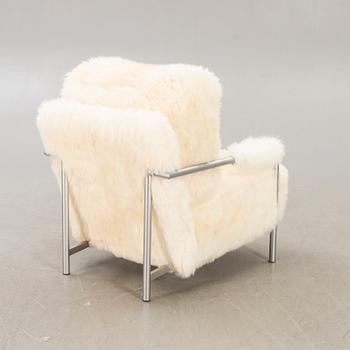 A 21st century Eilersen cheep skin armchair.