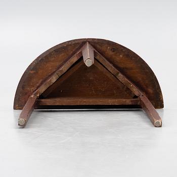 A 'half-moon table', 19th century.