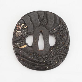 An iron and copper Tsuba, signed Goshu Hikone Ju, late Edo.