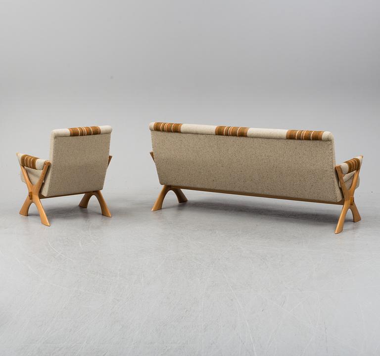 A 1960/70's pine sofa, armchair and coffee table.