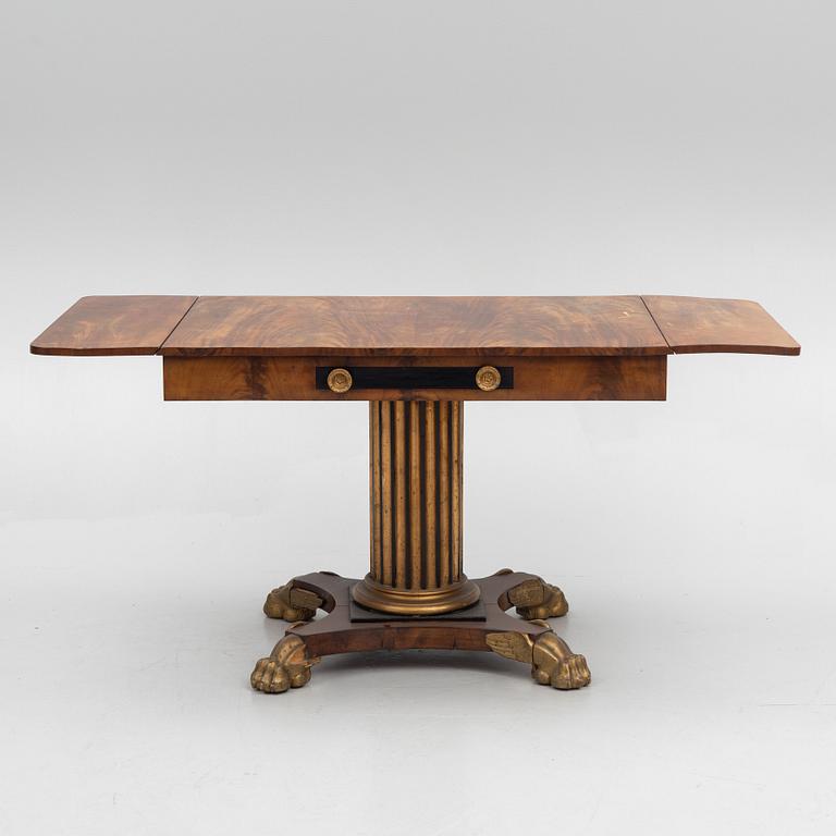 An Empire table, first half of the 19th Century.