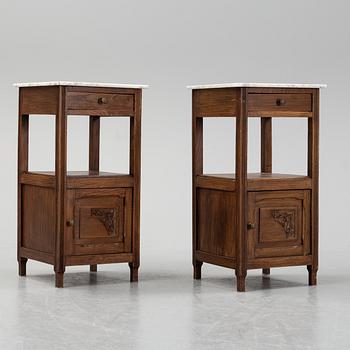 A pair of early 20th Century bedside tables.