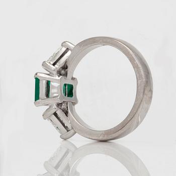 A circa 1.85ct emerald and trilliant-cut diamond ring.