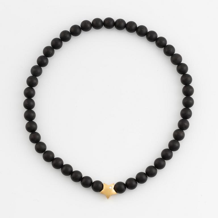 Ole Lynggaard, black stone  bead necklace, clasp star 18K gold with brilliant cut diamond.