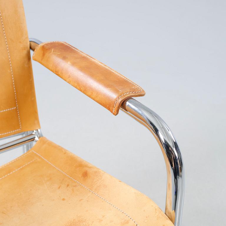 An armchair designed by Tord Björklund, named "Klinte" and made in the fourth quarter of the 20th century.