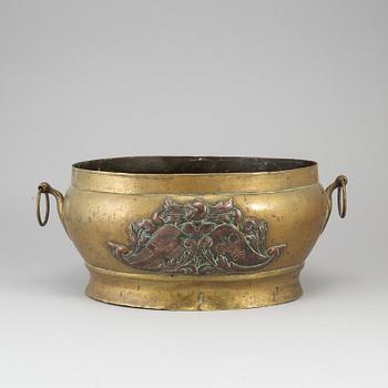 A 17th century brass and copper champagne cooler.