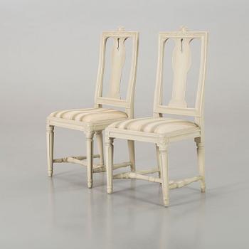 A piar of signed Swedish Gustavian chairs.