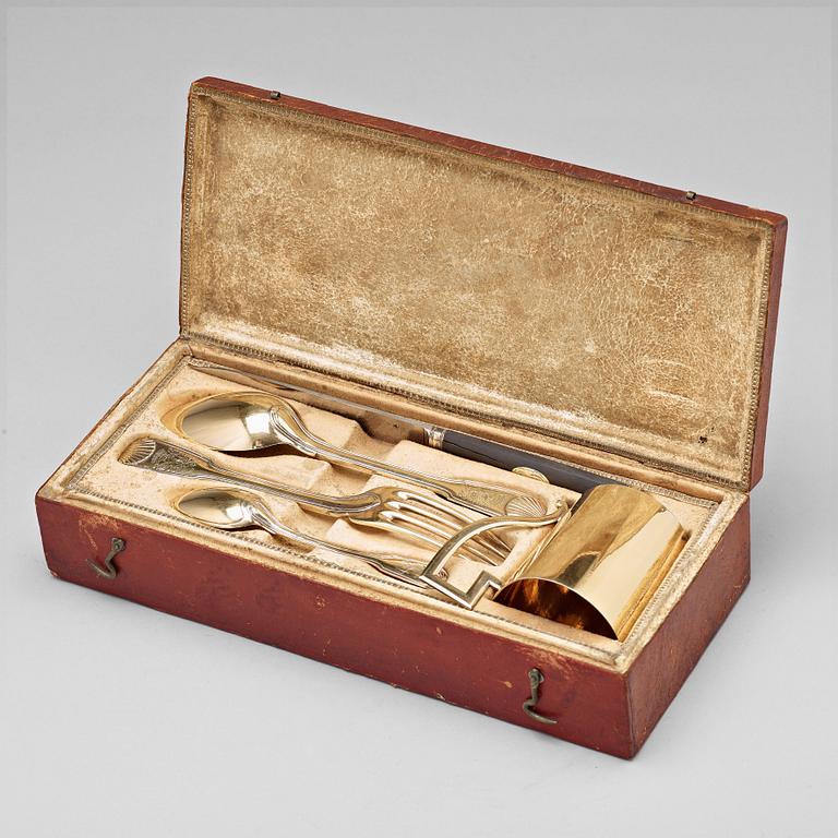 A five piece set of silver-gilt travel-cutlery, unidentifiable makers mark, Paris 1798-1809, in original box.