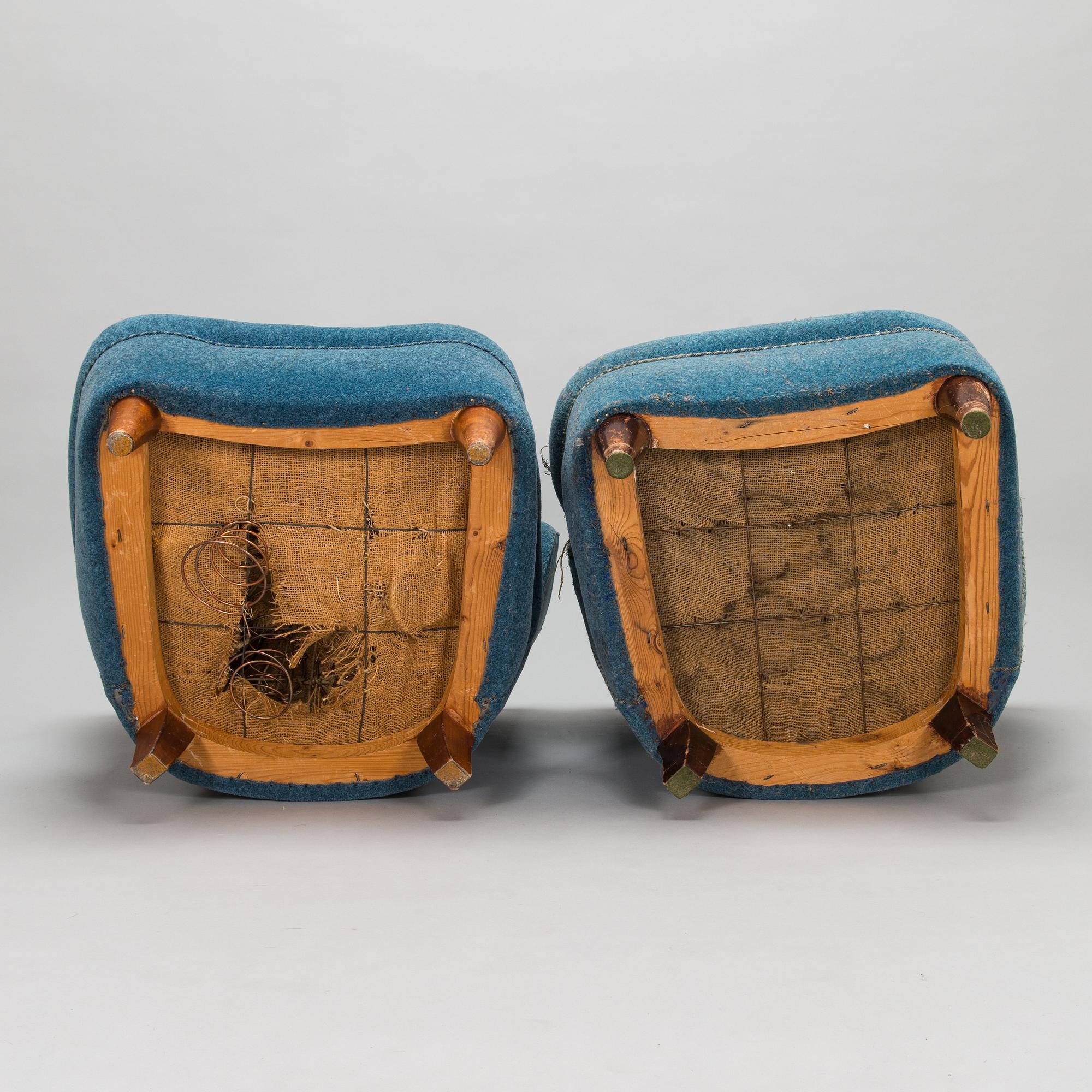A pair of mid-20th-century armchairs.