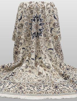 A Nain carpet, part silk, so-called 9 LAA, approx. 355 x 248 cm.