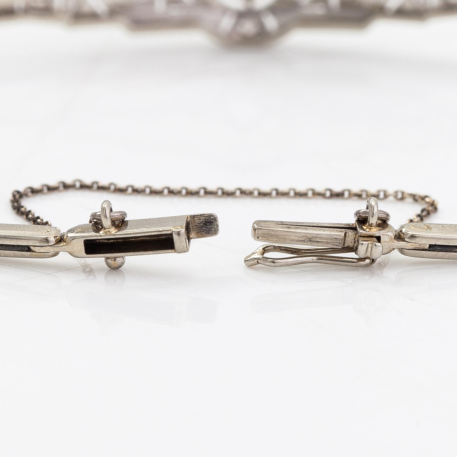 An 18K white gold bracelet with diamonds ca. 0.20 ct in total. A.R.Weckman, Helsinki 1939.
