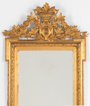 A Gustavian style mirror, around 1900.