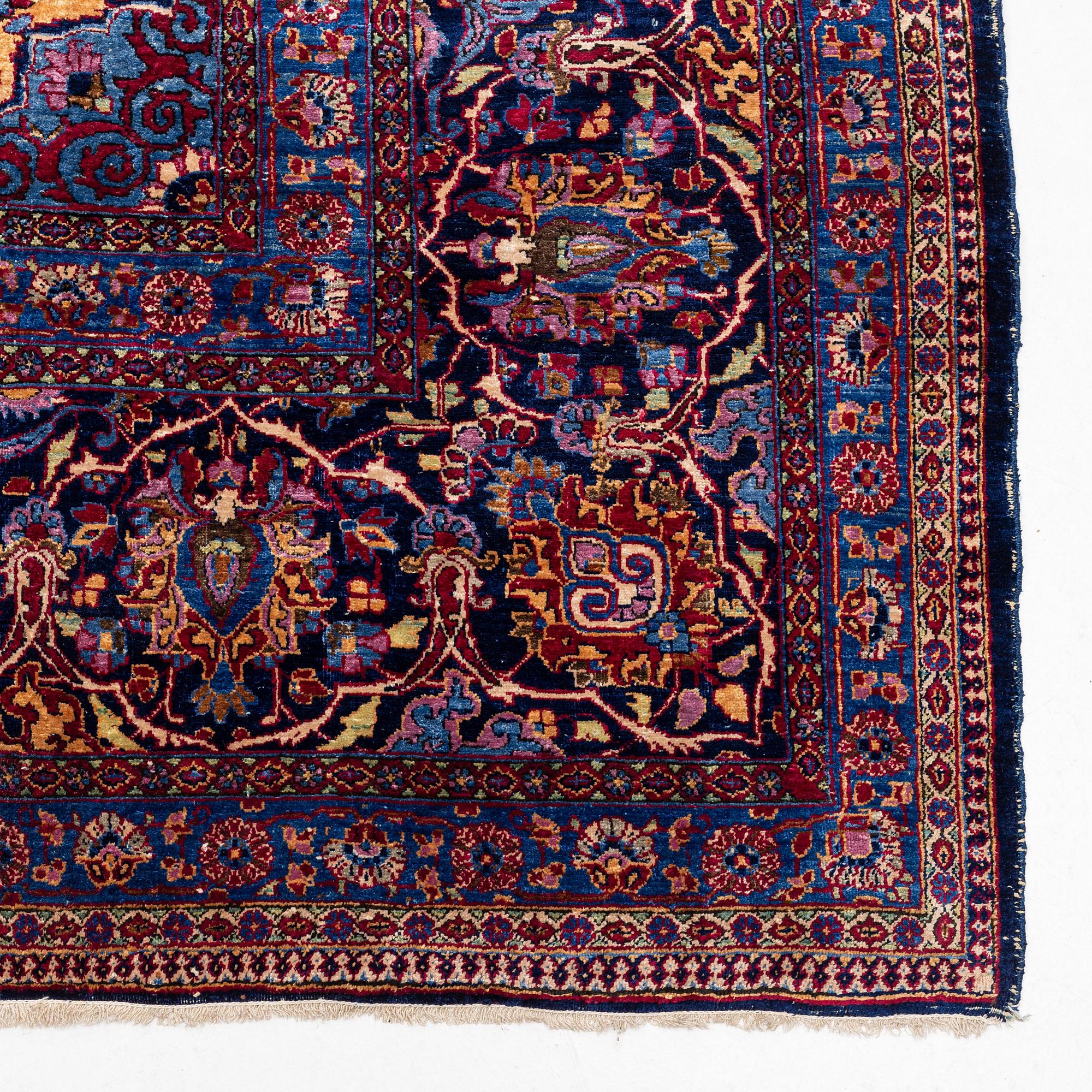 An antique silk Kashan carpet, central Persia (Iran) c. 378 x 259 cm.