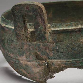 A bronze tripod food vessel and cover, "Ding", Eastern Zhou Dynasty.