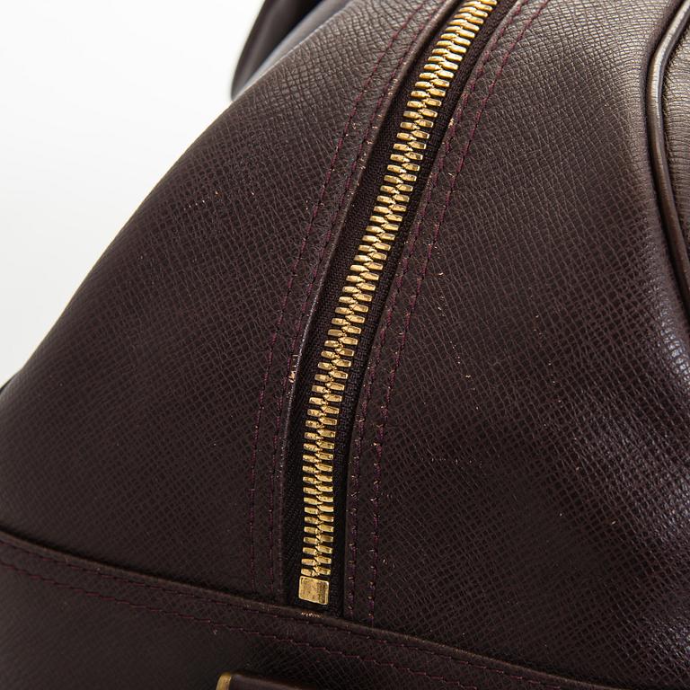 Louis Vuitton, a 'Taiga Kendall PM' weekend bag.