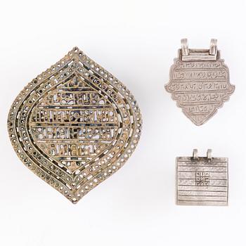 TWO SILVER PLAQUE AMULETS, silver and brass and  BRASS STAMP, North India, before 1960's.