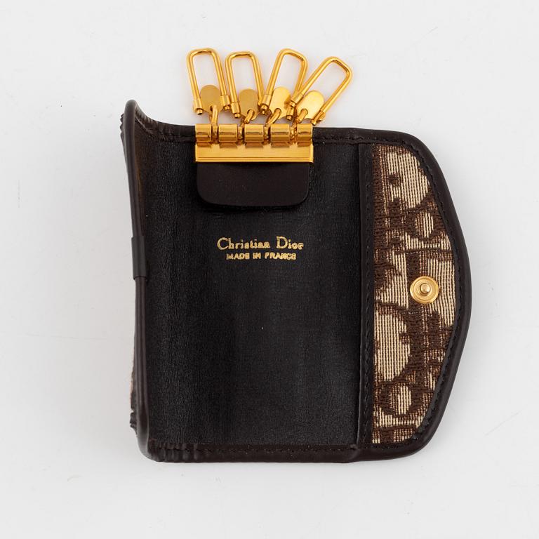 Christian Dior, a clutch, coin purse, key holder and silk scarf.