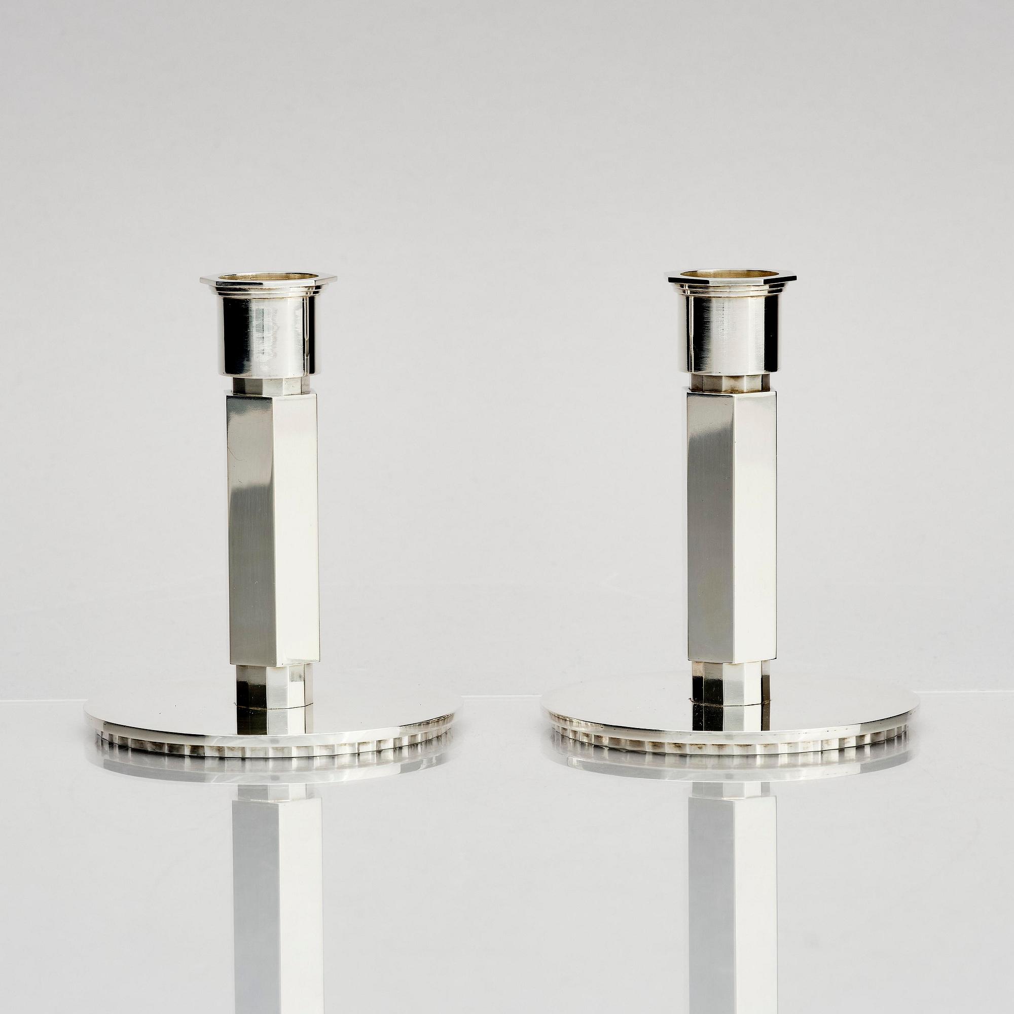 Wiwen Nilsson, a pair of sterling silver candlesticks, Lund, Sweden 11957 and 1960.