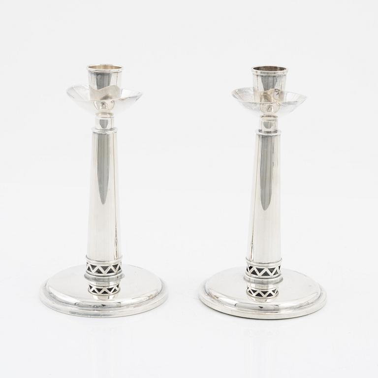 A pair of silver candle sticks, Tesi, 1960.