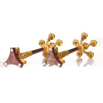 A pair of French Empire ormolu and rouge griotte six-branch candelabra, first part of the 18th century.