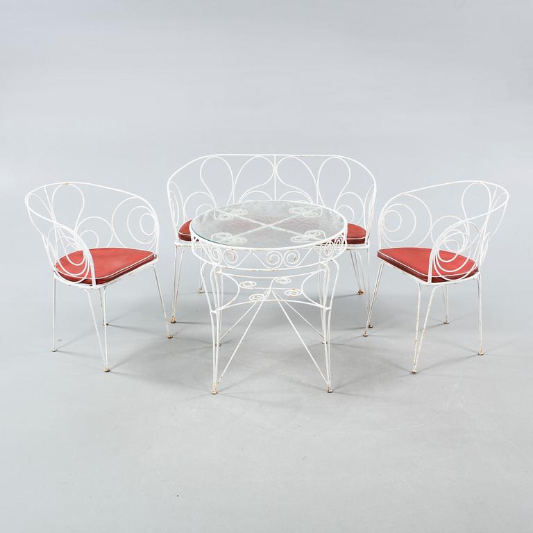 Four 20th century garden furnitures.