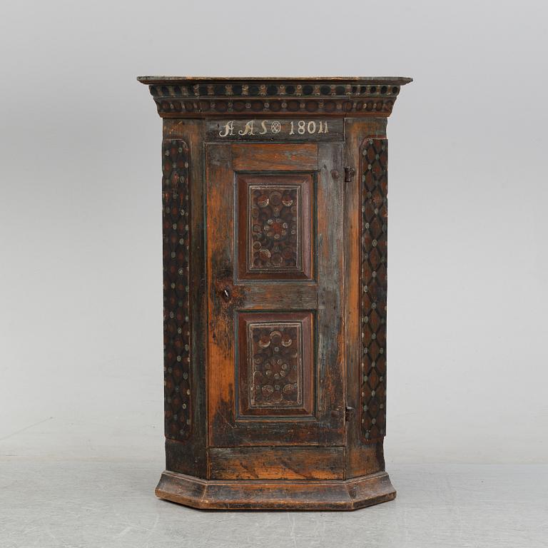 A painted corner cabinet, 19th Century.