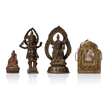 881. A group of deities and religious objects, Nepal/Tibet, 19th/20th Century.