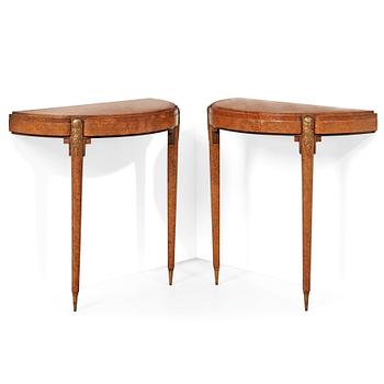 A pair of French Art Déco demi-lune console tables in the manner of Paul Follot, France 1920-30.