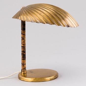 PAAVO TYNELL, A DESK LAMP. A shell.  Manufactured by Taito Oy. Designed in 1938/39.