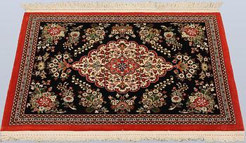 A pair of Tabriz rugs, part silk, so-called 50 Raj, 92 x 62 cm.