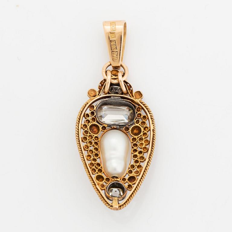 An 18K gold and silver pendant set with old-cut diamonds and a pearl, most likely natural.