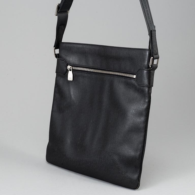 LOUIS VUITTON, a black Taiga bag, 2012.