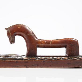 A carved and polychrome painted mangle board, Sweden, late 18th / early 19th century.