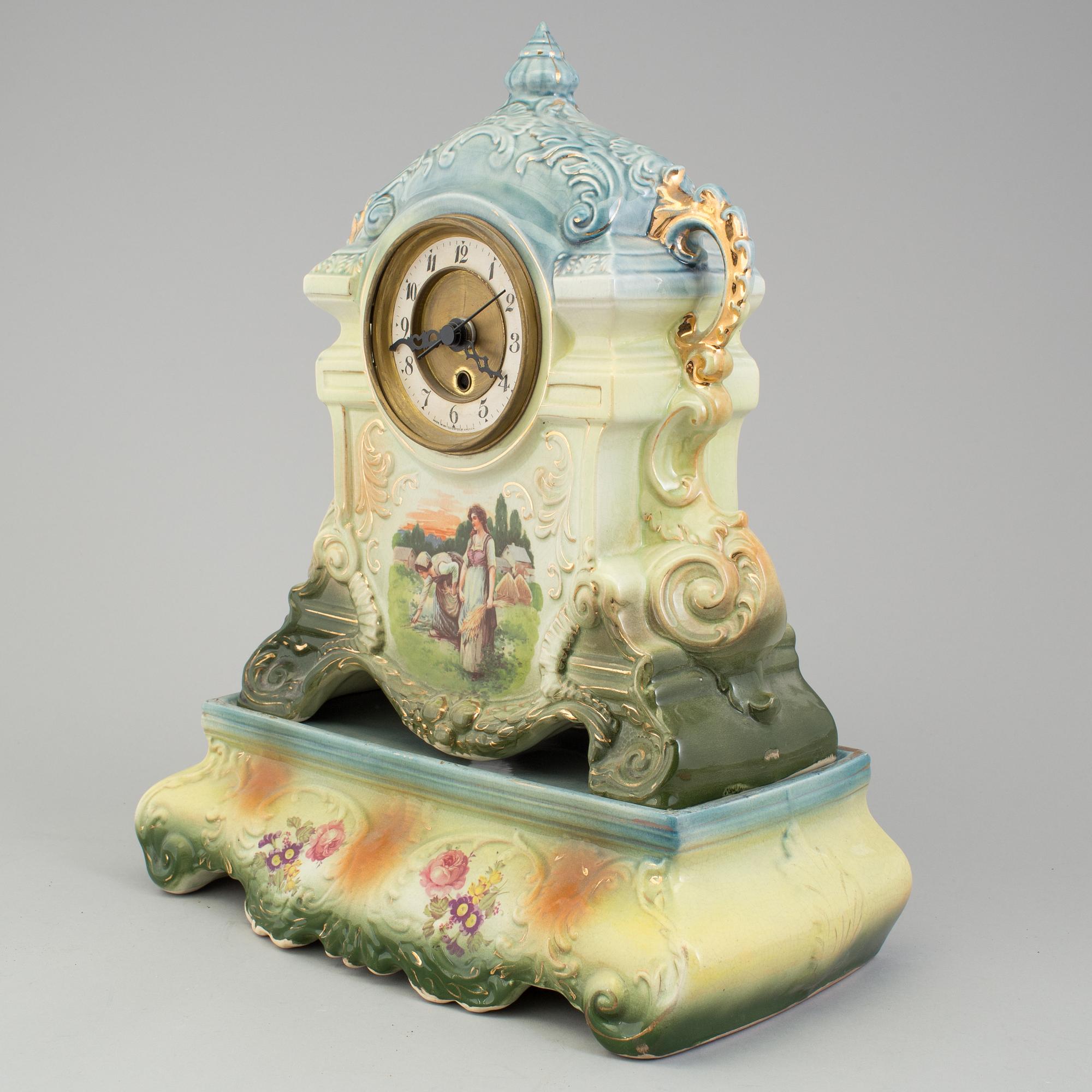 A creamware mantle clock, circa 1900.