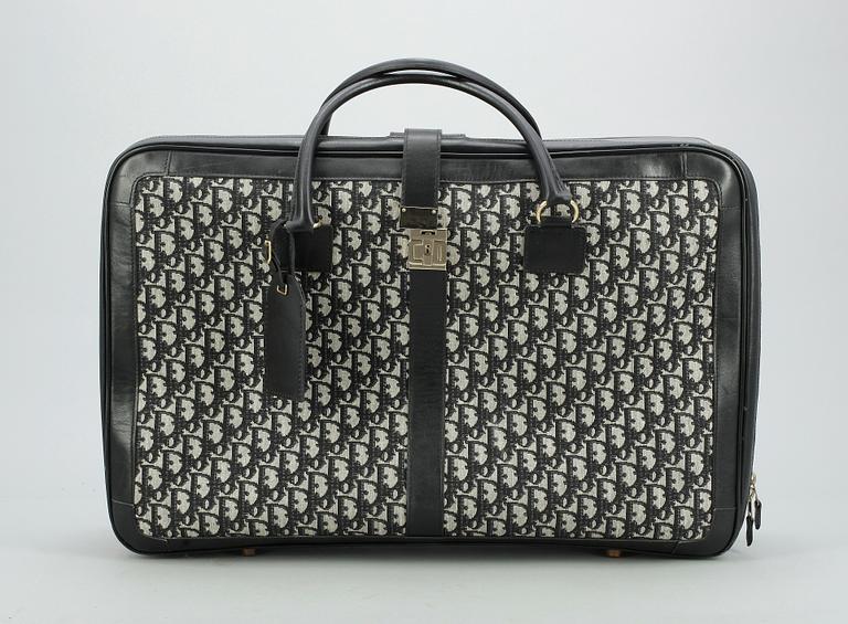 CHRISTIAN DIOR, a monogram canvas suitcase.