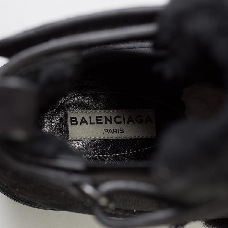 a pair of boots by Balenciaga, in size 36,5.