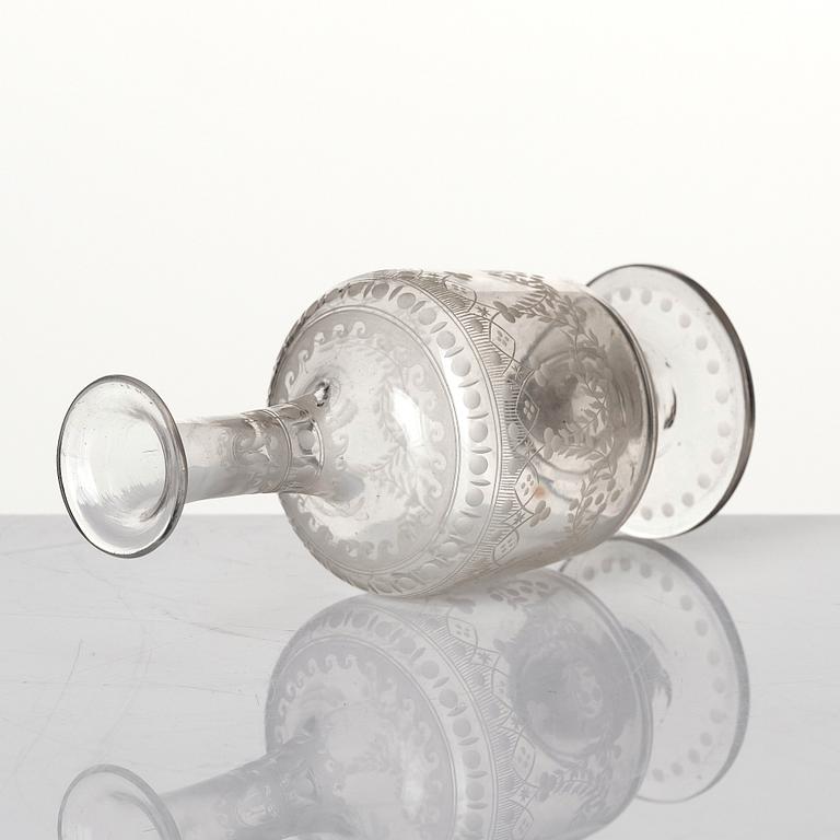 An engraved flask, circa 1800.