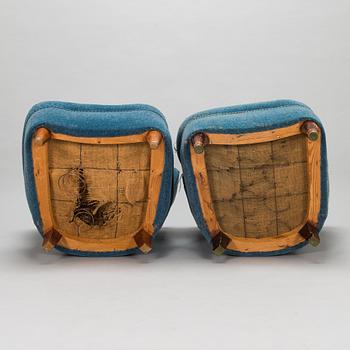 A pair of mid-20th-century armchairs.