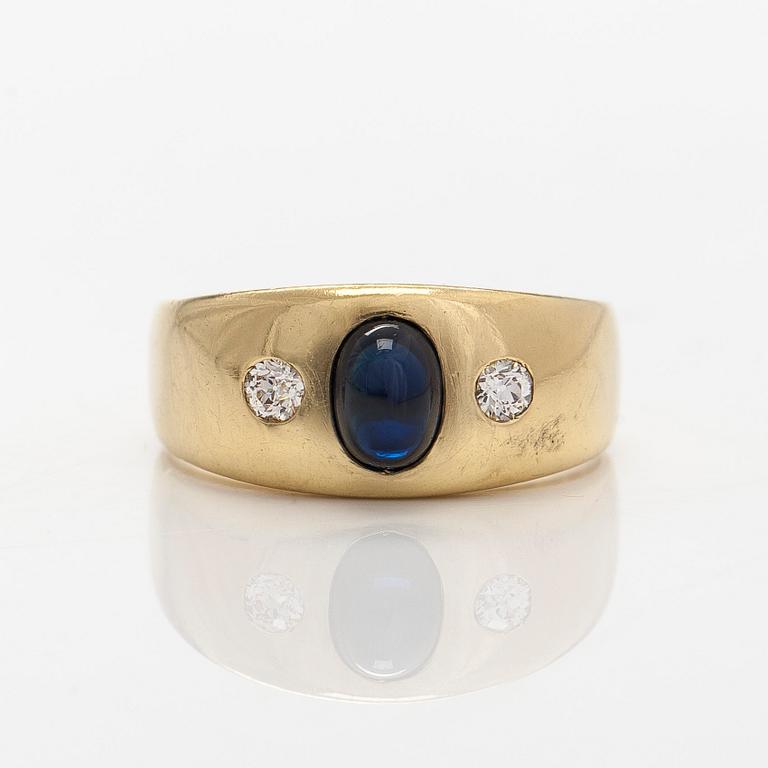 Ring, 18K gold, with a cabochon-cut oval sapphire and diamonds.