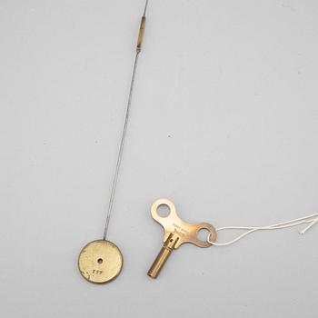 A mid 19th Century brass and gilt brass mantel clock.