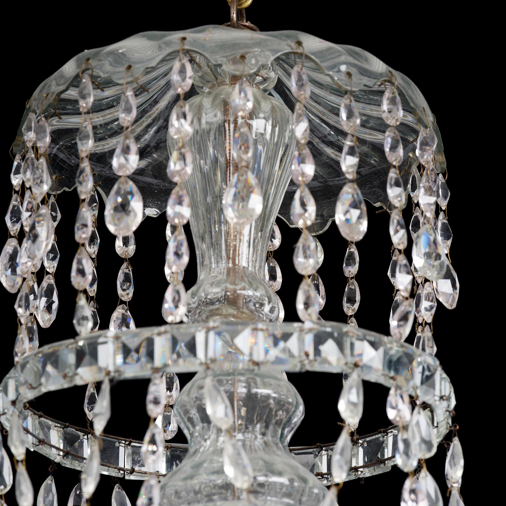 A Bohemian Louis XVI moulded and cut-glass six-branch chandelier, late 18th century.