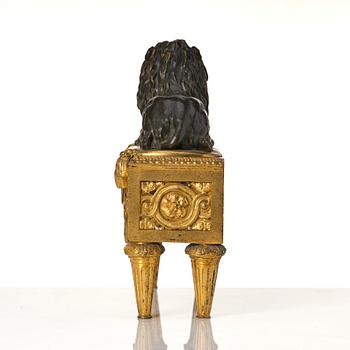 A pair of Louis XVI gilt and patinated bronze chenets.