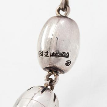 A set of sterling silver "Halikko treasure" necklace, bracelet, ring and earrings. Kalevala Koru, Helsinki 1975 and 1975.