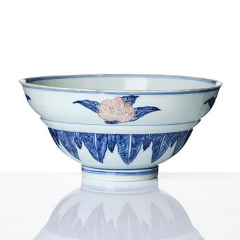 A blue and white and copper-red 'peaches' bowl, Qing dynasty.