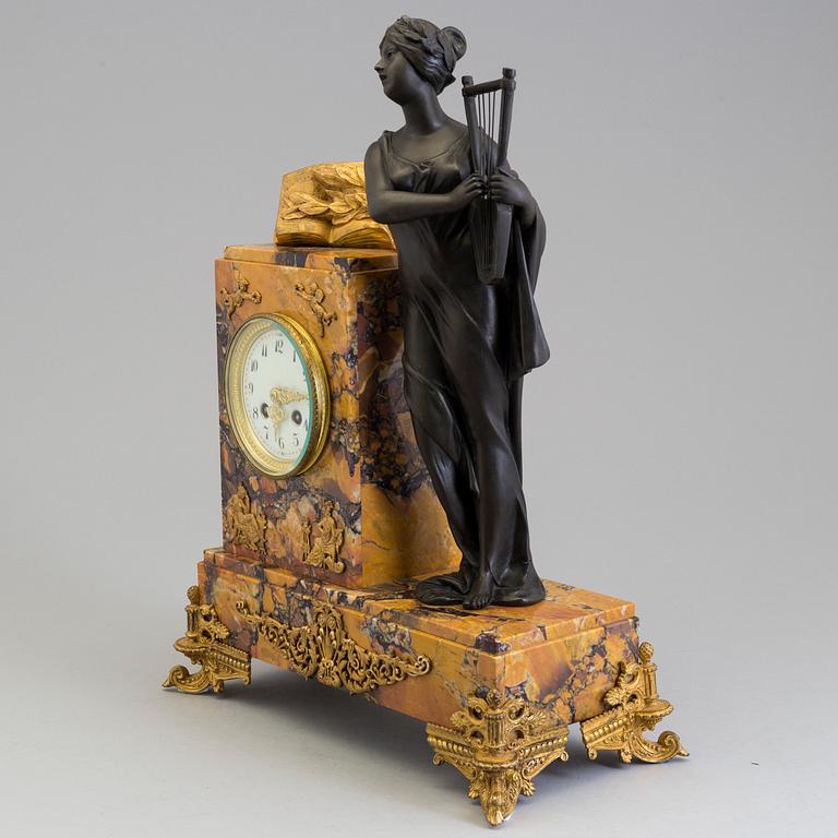 A turn of the century 1900 gilt brass and marble century mantle clock.
