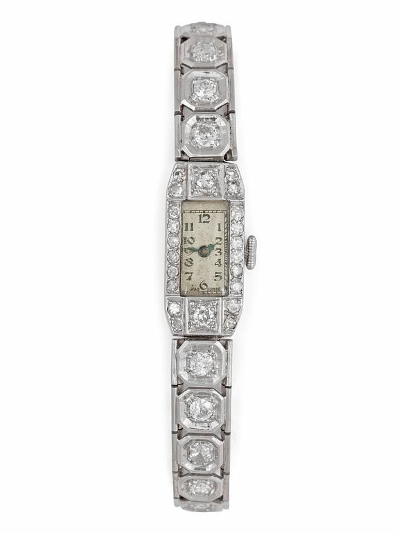 A diamond ladie's wrist watch, tot. app. 3.20 cts. 1940's.