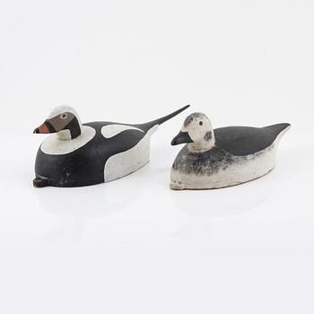 Two wooden decoy ducks, signed Eric Österman 1916.