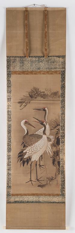 A scroll painting with cranes, signed Tsunenobu.