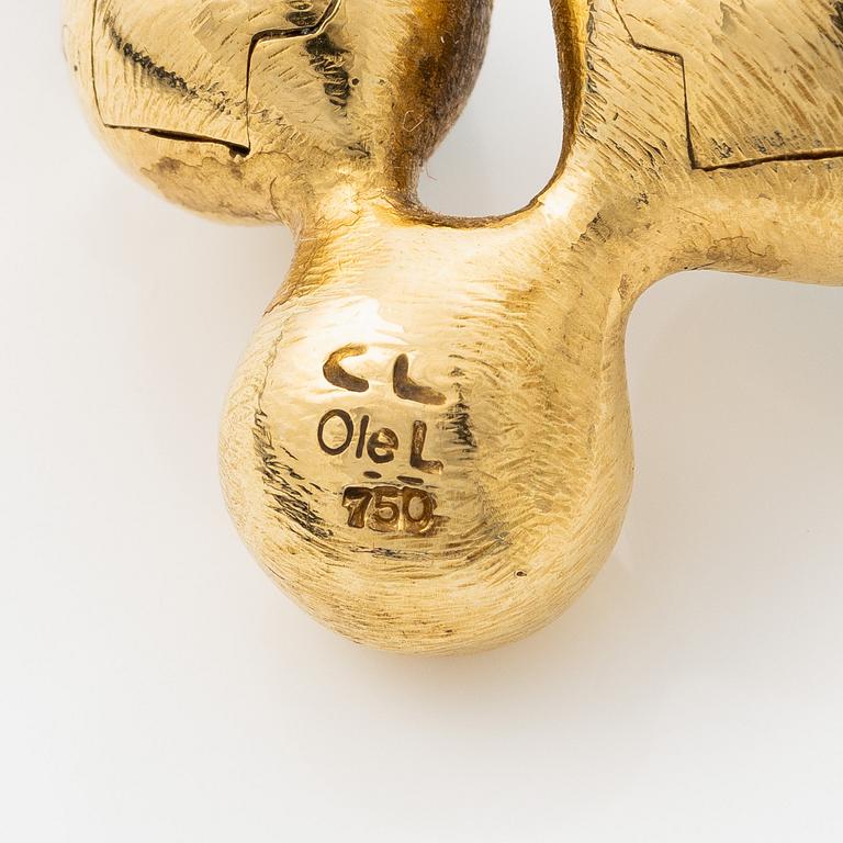 Ole Lynggard lås 18K guld med akvamariner och en rund briljantslipad diamant, design Charlotte Lynggard.